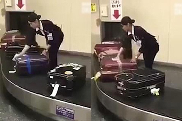 Nữ nhân viên sân bay lau từng chiếc vali của khách gây sốt