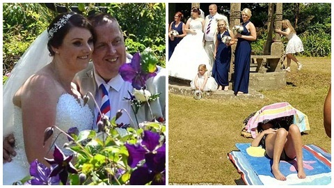 Cô gái tắm nắng giữa công viên mặc cô dâu, chú rể chụp ảnh bên cạnh