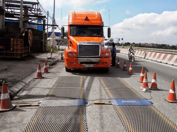Overloaded trucks destroying Vietnam’s roads