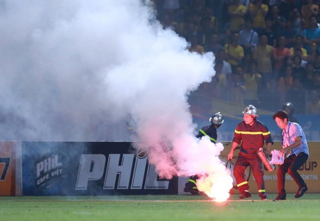 Woman injured by flares at Hanoi football clash