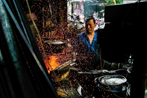 The last iron forger keeps the furnace’s flame burning on Hanoi’s old street