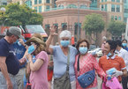 Locals, tourists receives free masks in HCM City