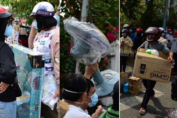 Bên ngoài khu cách ly ở ký túc xá, bố mẹ ngậm ngùi vác nệm, quạt về nhà