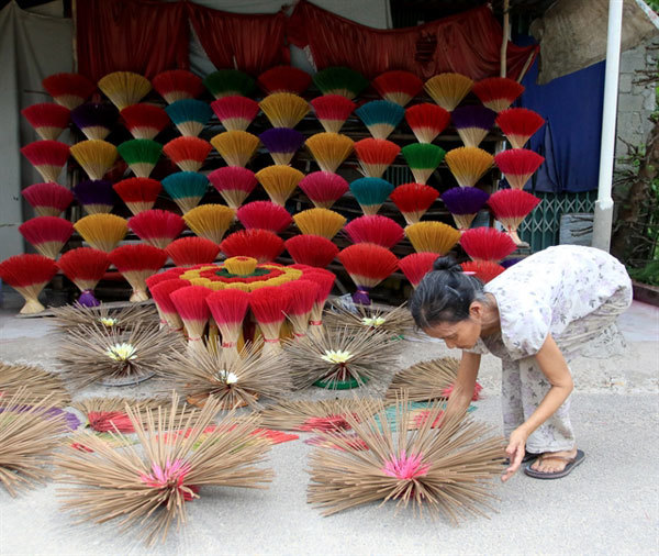 Sights and smells of incense making village lure tourists