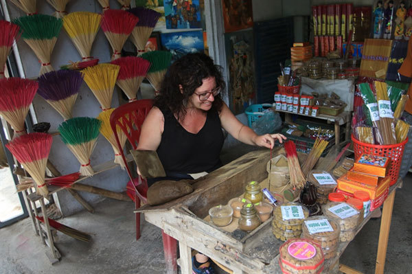 Sights and smells of incense making village lure tourists