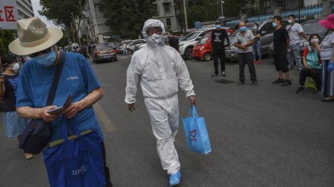 Coronavirus: Beijing tightens controls amid spike in local cases