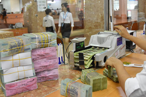 Bad debts return, bank profits fall