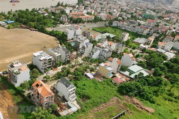 Real estate firms spend trillions of VND to buy land plots