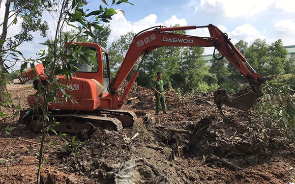 Untreated solid waste illegally buried and burned