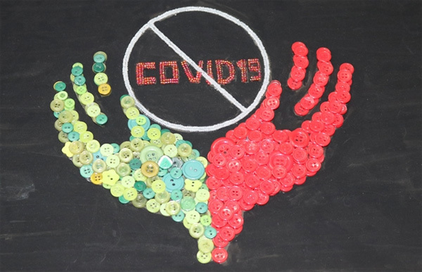 Discarded plastic buttons turned into colourful art