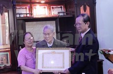 First Vietnamese in Laos honoured with 70-year Party membership insignia