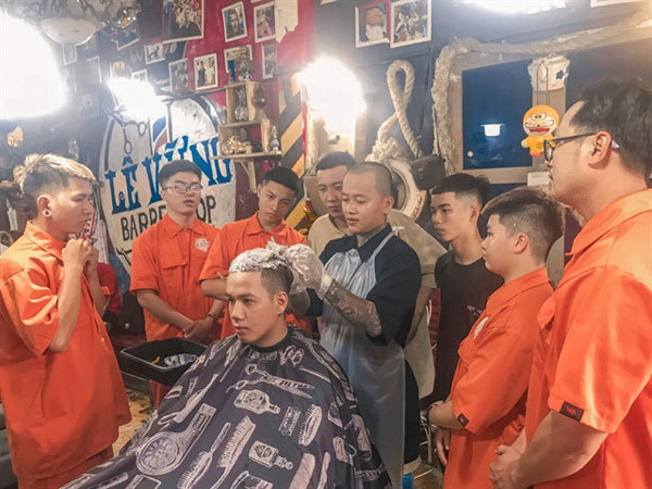 Barbers trim the cost of hair cuts for people in Mekong Delta