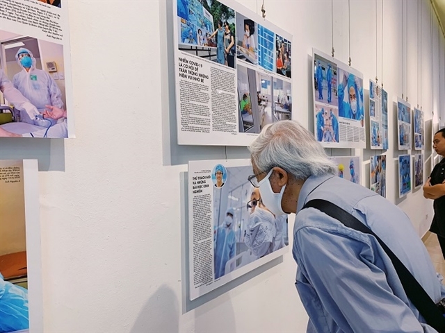 Photo exhibition reveals untold stories of COVID-19 fighters