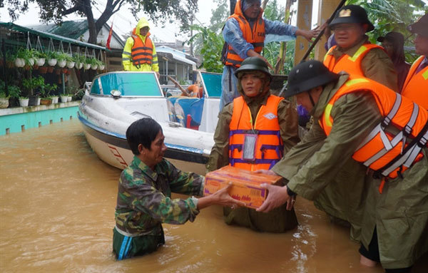 Heavy rain, floods wreak havoc in central provinces as new typhoon approaches