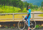 Female cyclist on trans-Vietnam route
