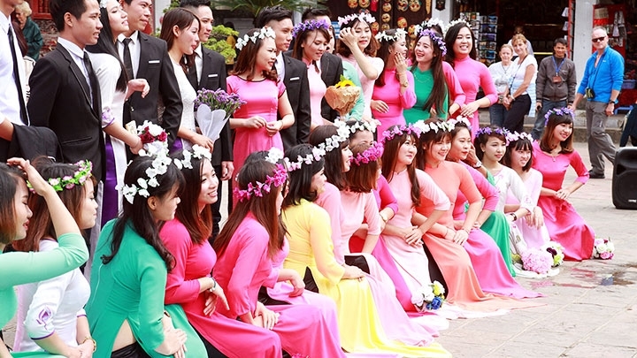 Ao Dai, A woman wearing the traditional Vietnamese Ao Dai p…