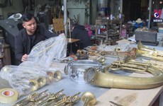 Village in northern Vietnam repairing trumpets for generations