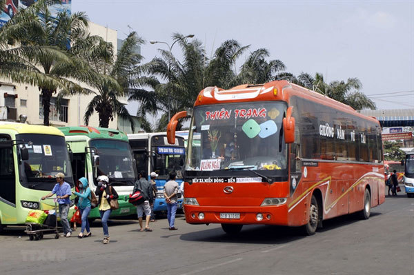 HCM City bus stations start to get Tet crowds, Covid precautions in place