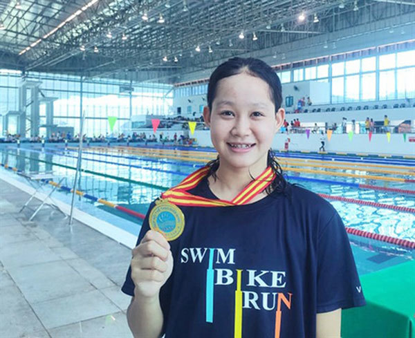 Fifteen-year-old swimmer Van makes a splash