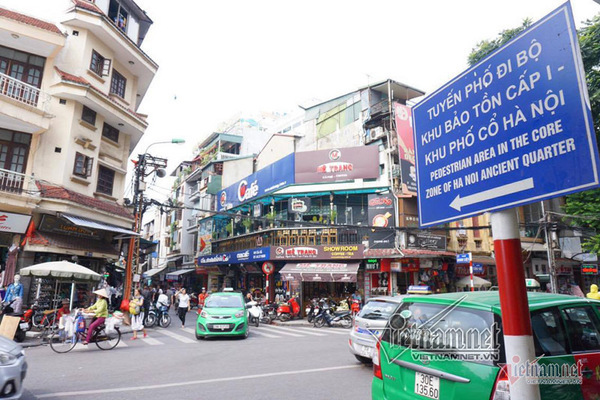 How will Hanoi relocate 215,000 people in four inner city districts?