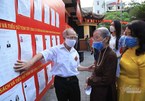 96-year-old woman and her relatives go to vote in Hanoi