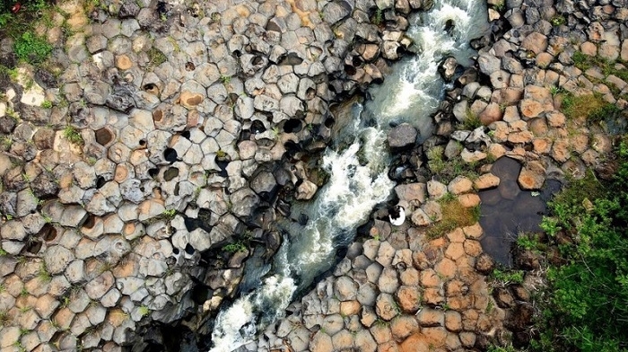 Impressive stone blocks across Jrai Pha stream in Gia Lai