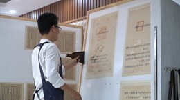 Young man breathing new life into ancient books