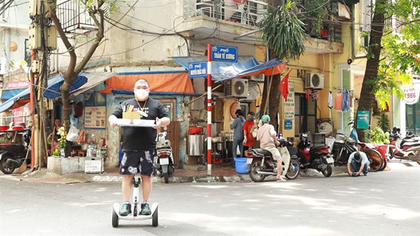 Noodle soup shop owner makes deliveries on hoverboard