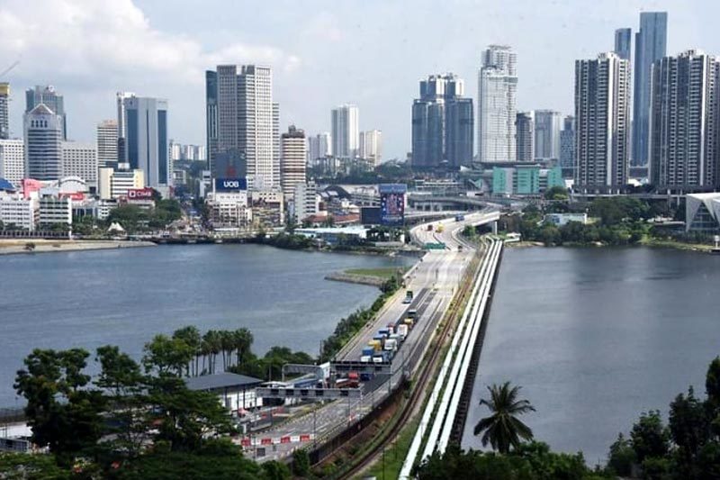 Singapore, Malaysia mở cửa biên giới trên bộ cho người đã tiêm chủng