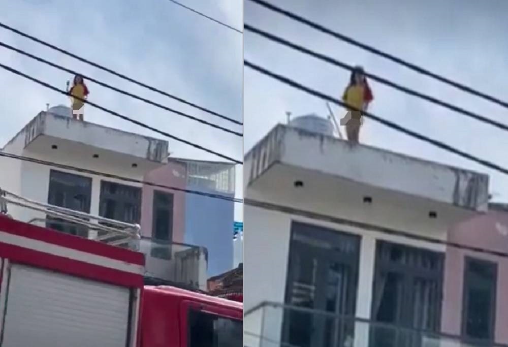 Cảnh sát giải cứu cô gái múa 'thoát y' trên nóc nhà ở TP.HCM