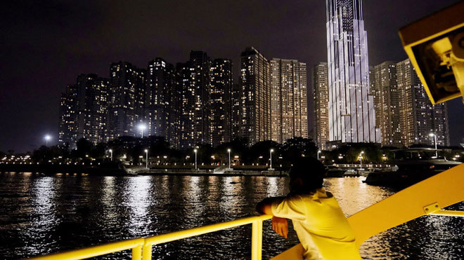 HCM City people enjoy Saigon River at night with public waterbus