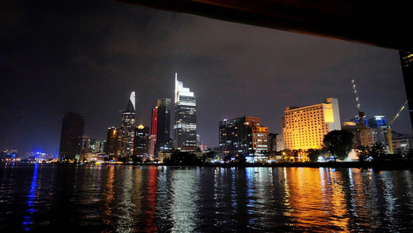 HCM City people enjoy Saigon River at night with public waterbus