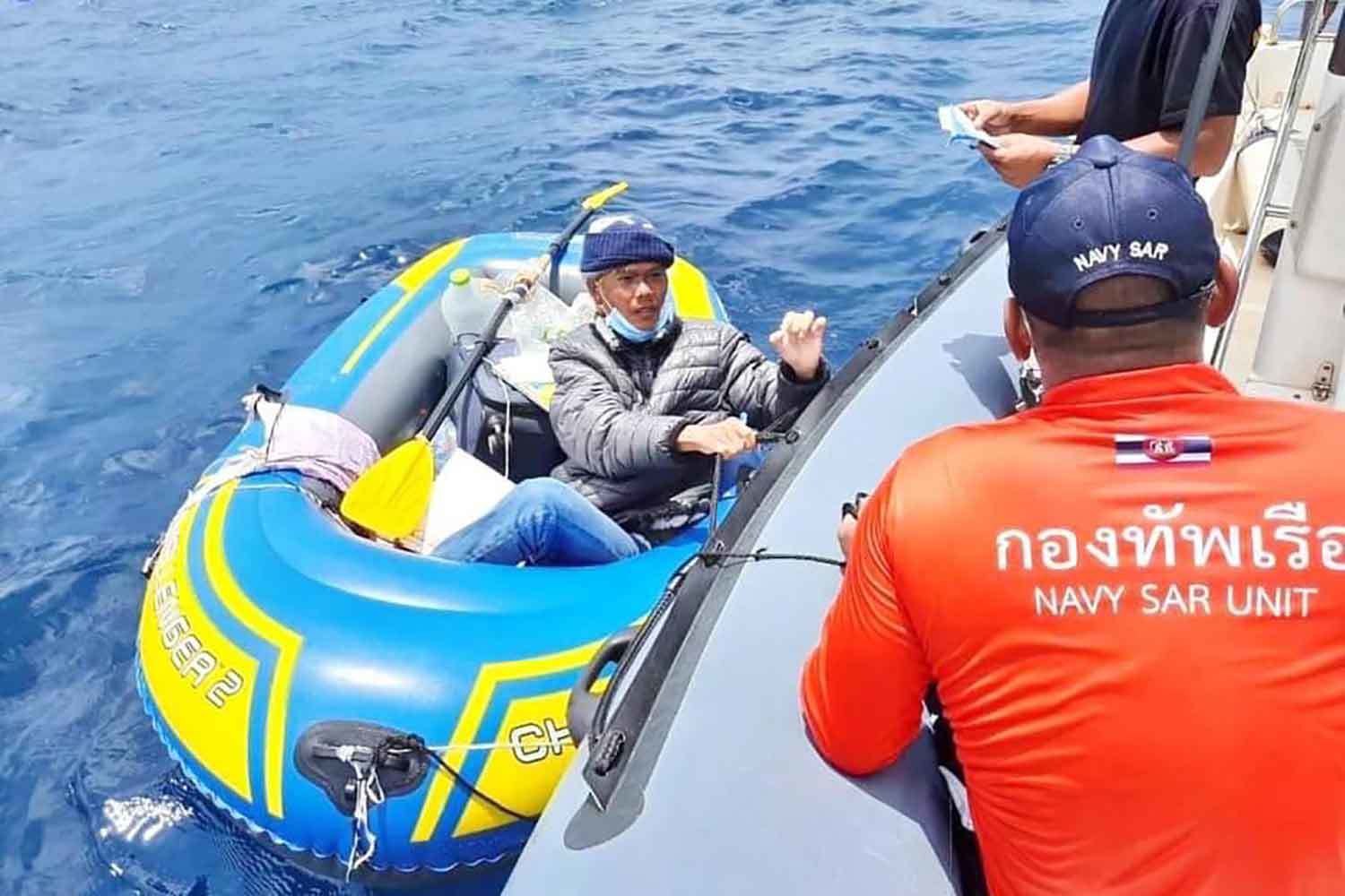 A Vietnamese man rowing a rubber boat intends to cross the sea to visit his wife in India