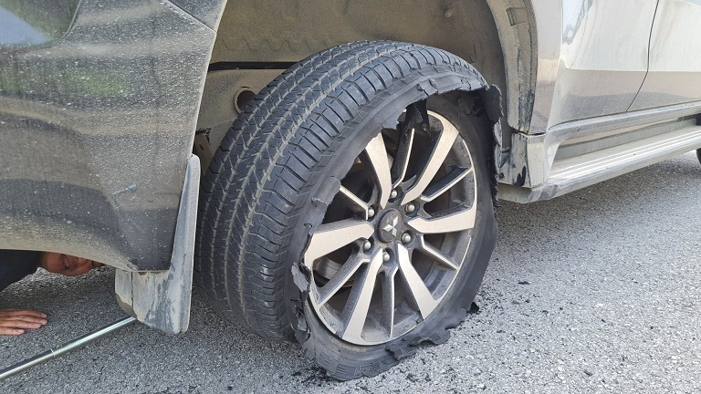 The driver shares how to deal with a car with a blown tire on the highway
